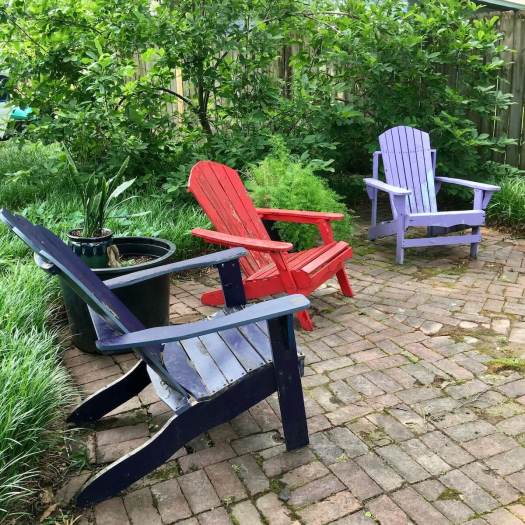 Wooden garden chairs in purple, red and dark blue