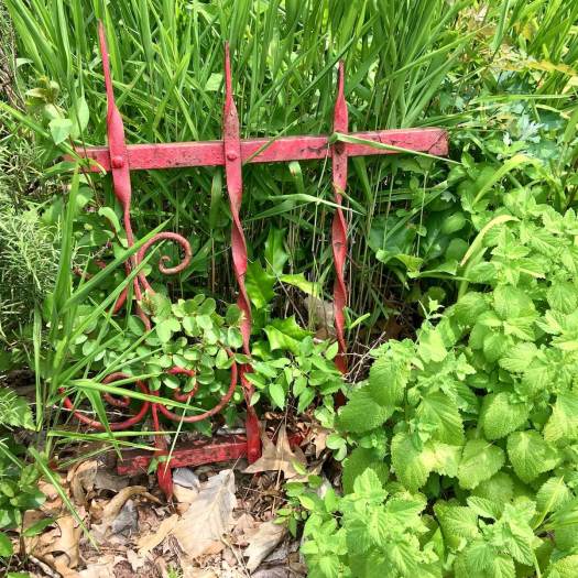 Wrought iron panel hints at a fence