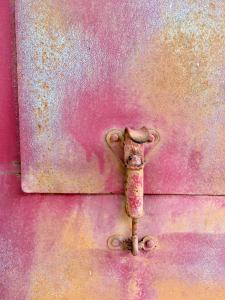 Distressed textures: red, pink, silver, beige on metal