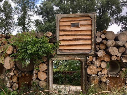 Ash logs and reclaimed material in the fauna wall