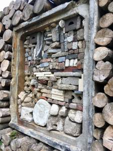 Wooden fauna wall with recycled bricks