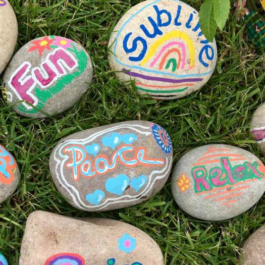 Peace pebble with blue hearts