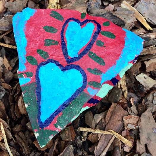 Two hearts painted on a stone