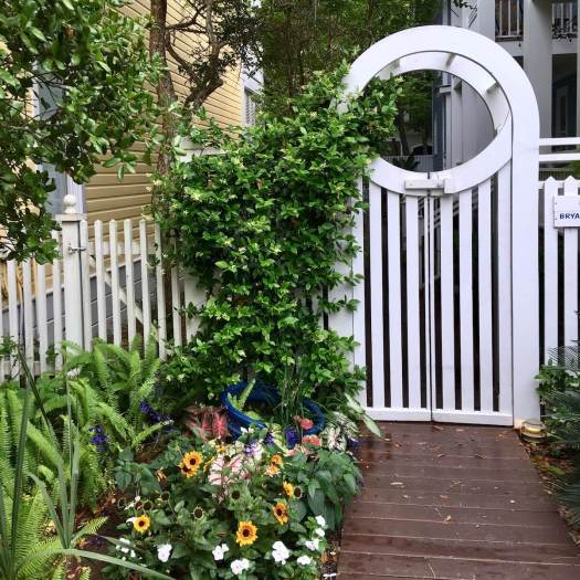 White picket fence with arched gate