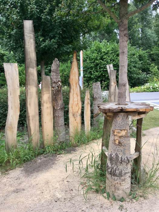 Fence made from mismatched tree slices