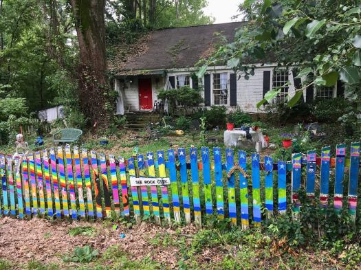 Painted fence keeping Fondren Funky by Jane Tucker