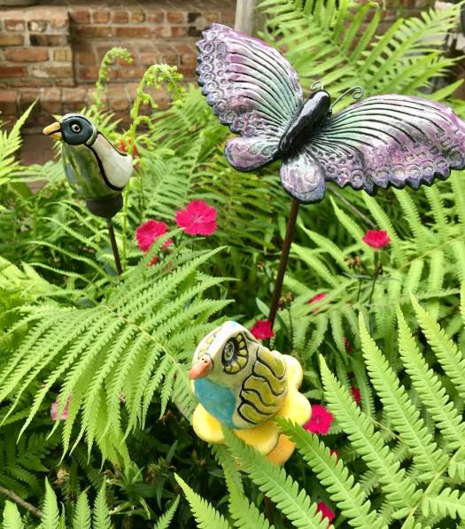 Ferns with bird and butterfly ornaments