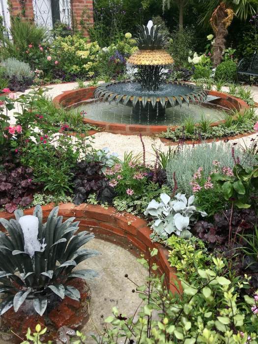 View from outside a show garden with fountains