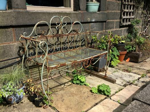 Scroll design metal bench