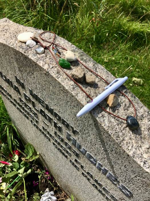 Tokens left on Sylvia Plath's headstone