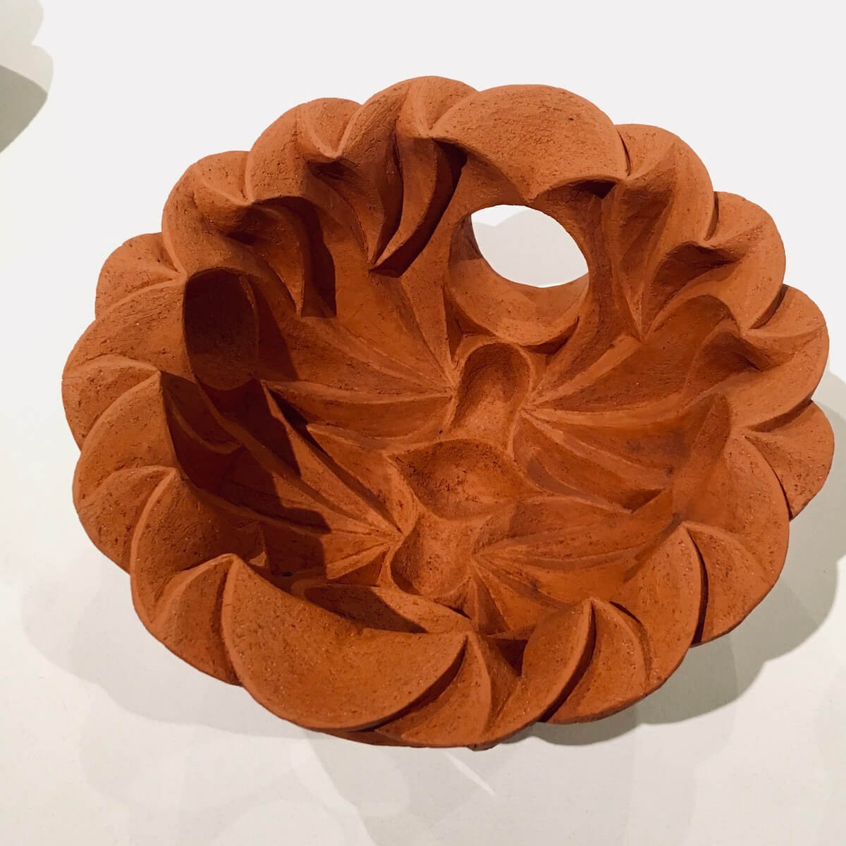 Terracotta-coloured ceramic by Hamila Cassell